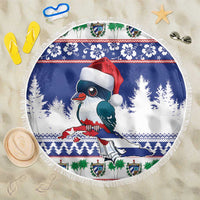 Round blue beach blanket with fringed edge and cartoon bird in Santa hat