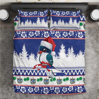 Blue holiday bedding set: duvet with bird in Santa hat, pine trees, striped festive borders