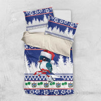 Blue duvet with bird in Santa hat and pine trees; two matching pillowcases