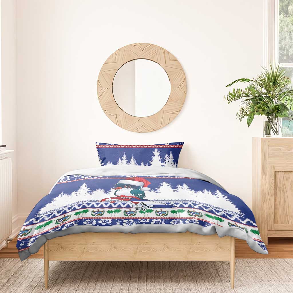 Blue bedspread duvet with bird in Santa hat, pine tree scene, holiday patterned borders