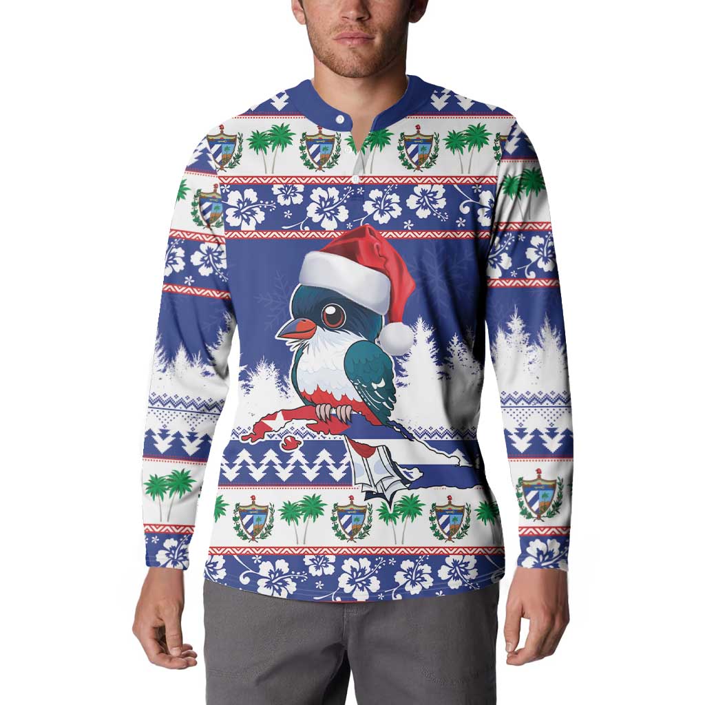 Blue Christmas sweatshirt on model, featuring toucan, Santa hat, and festive border print