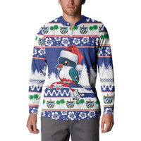 Blue Christmas sweatshirt on model, featuring toucan, Santa hat, and festive border print