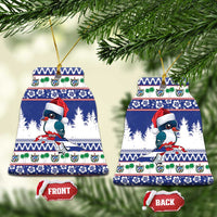 Blue ceramic bell-shaped Christmas ornament with bird wearing Santa hat, front and back
