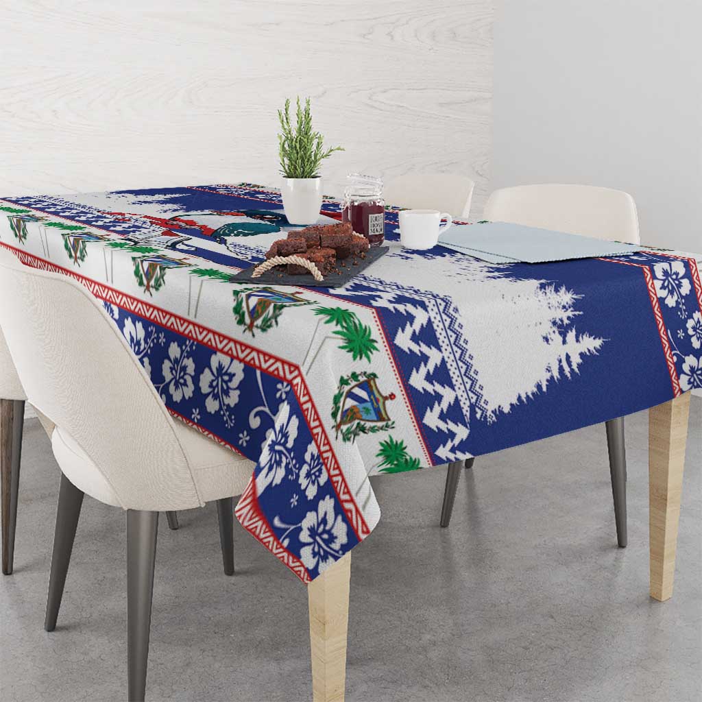Blue Christmas tablecloth on dining table with bird motif, evergreen trees, and red edging