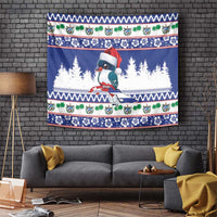 Blue Christmas bird tapestry with Santa hat, pine trees, and festive border bands