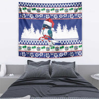 Blue bird Christmas tapestry featuring a Santa-hat toucan and patterned holiday trim
