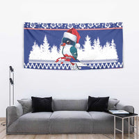 Blue Christmas bird tapestry with Santa hat, pine scene, and striped festive edging