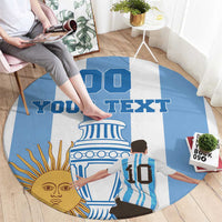 Round blue-and-white rug with custom text and illustrated sun face and Argentina figure artwork