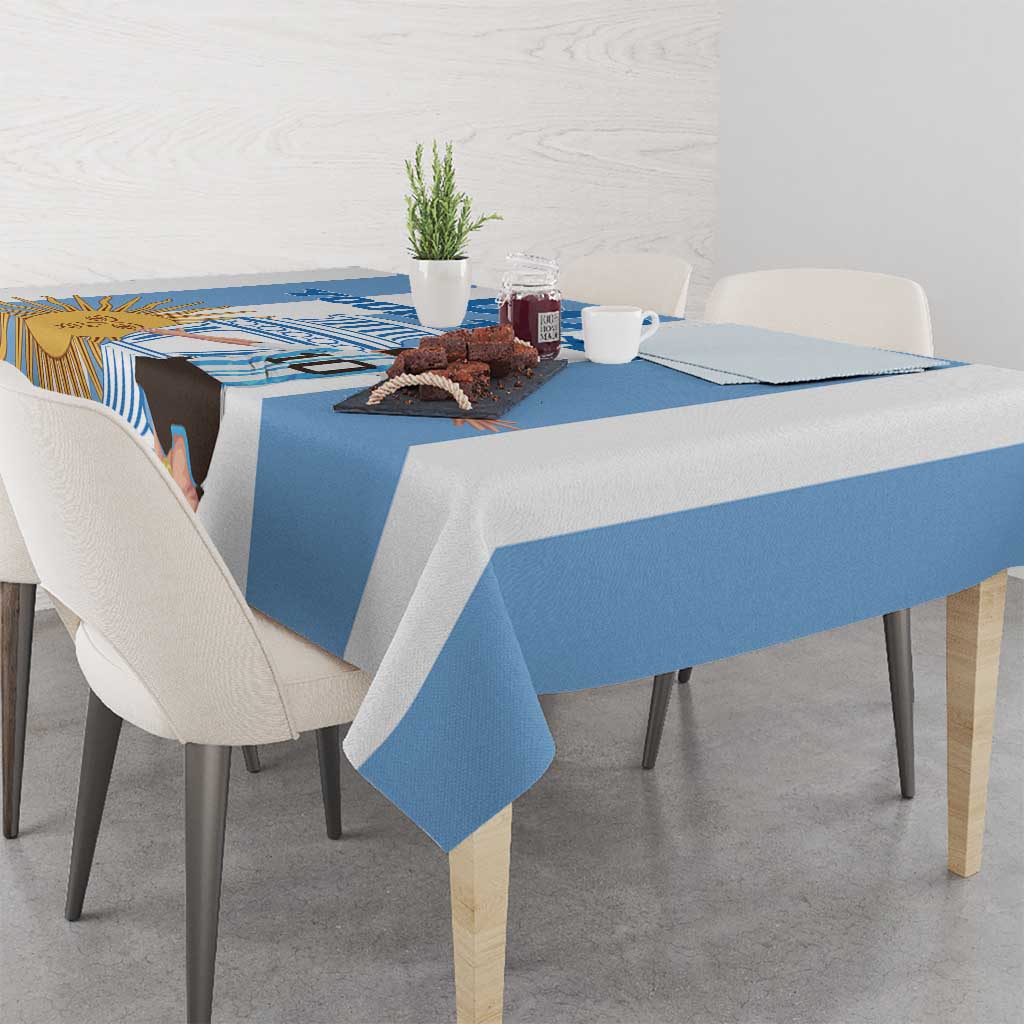 Blue and white Argentina football tablecloth with sun-and-trophy print across the tabletop.