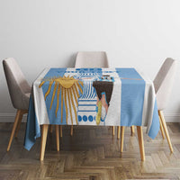 Rectangular blue and white tablecloth featuring sun, player, and trophy graphics on top.