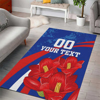Blue area rug with red flowers and stripes, '00 YOUR TEXT' graphic panel