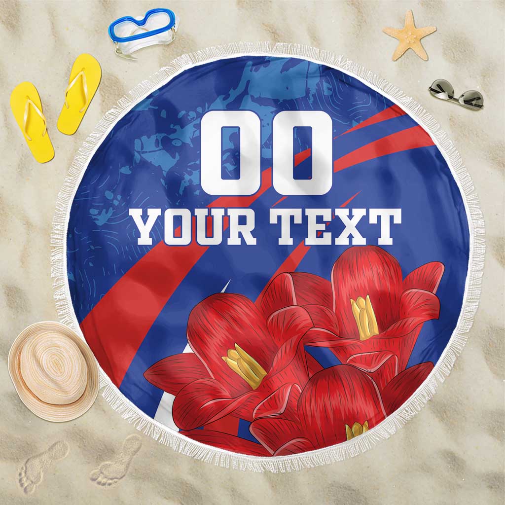 Round blue beach blanket with red diagonal stripes, red flowers, white fringe, “YOUR TEXT”