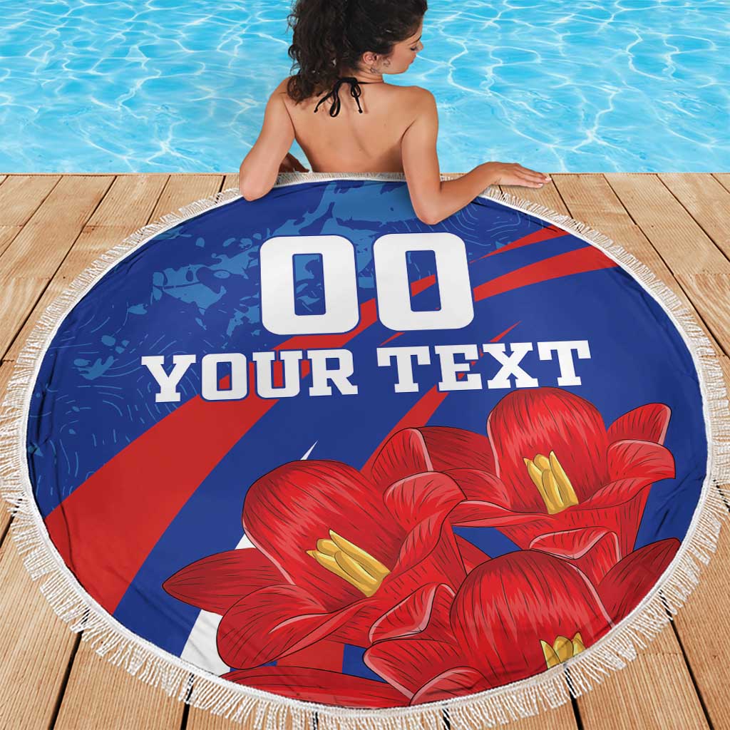 Round blue beach blanket with red diagonal stripes, red flowers, white fringe, “YOUR TEXT”