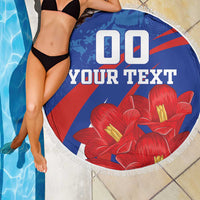 Round blue beach blanket with “YOUR TEXT” and red flowers, white fringe edging