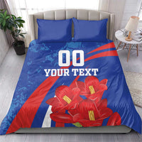 Blue bedding set with pillowcases, red flower print, and centered '00 YOUR TEXT' graphic
