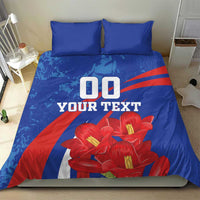 Blue bedding set with two pillowcases featuring red flowers and '00 YOUR TEXT' print