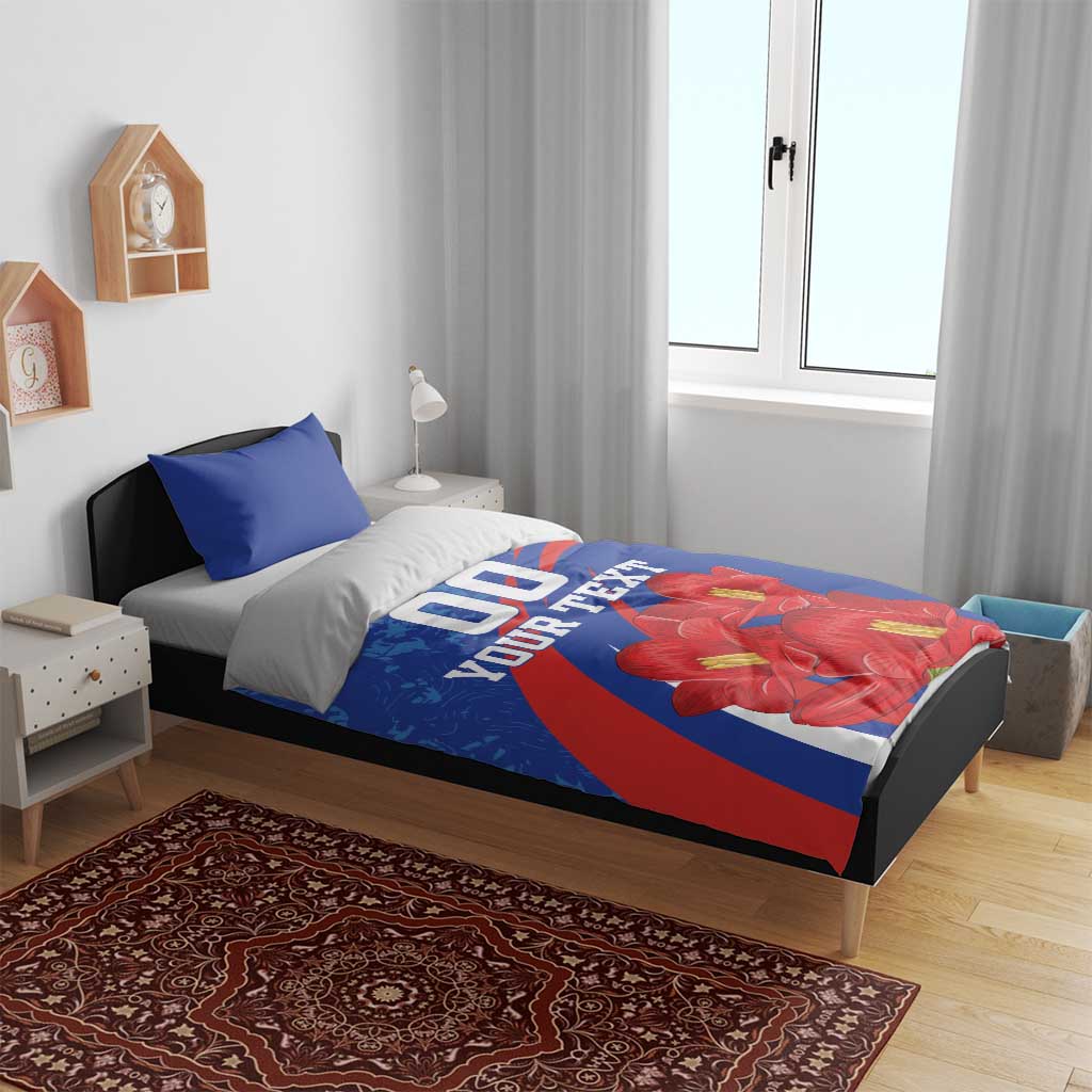 Blue bedding set on bed with blue pillowcases, red flower artwork, '00 YOUR TEXT'