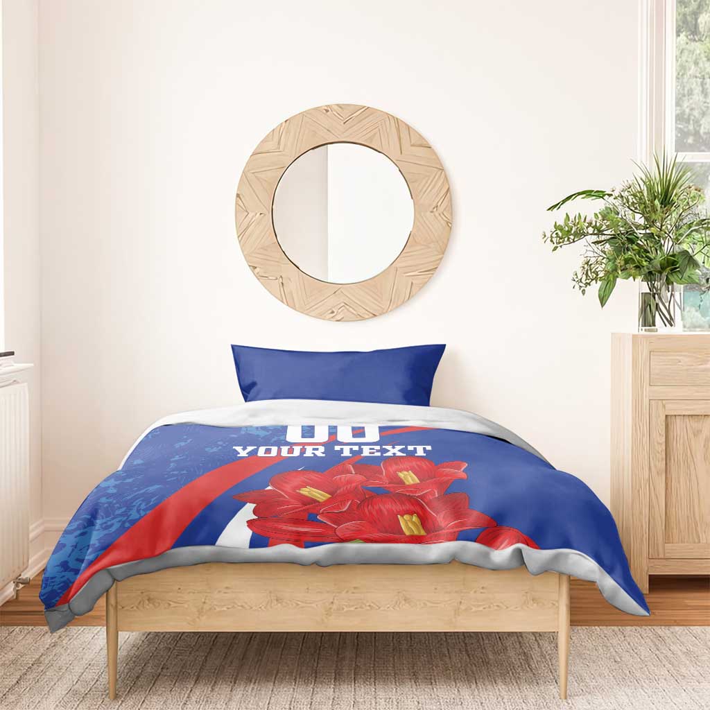 Blue comforter bedding set with pillowcases, red flowers, and '00 YOUR TEXT' design