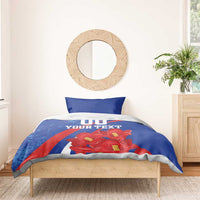 Blue comforter bedding set with pillowcases, red flowers, and '00 YOUR TEXT' design
