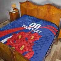Blue quilt on bedspread with red diagonal stripe, red flowers, and "00" with "YOUR TEXT".