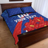 Blue quilt bed set with pillows, red flower print and custom text across diagonal stripes
