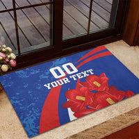 Blue rubber doormat with red stripe graphic and red flowers beneath custom text
