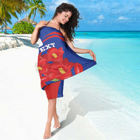 Blue sarong with red stripe bands and bold red flower print, custom text.