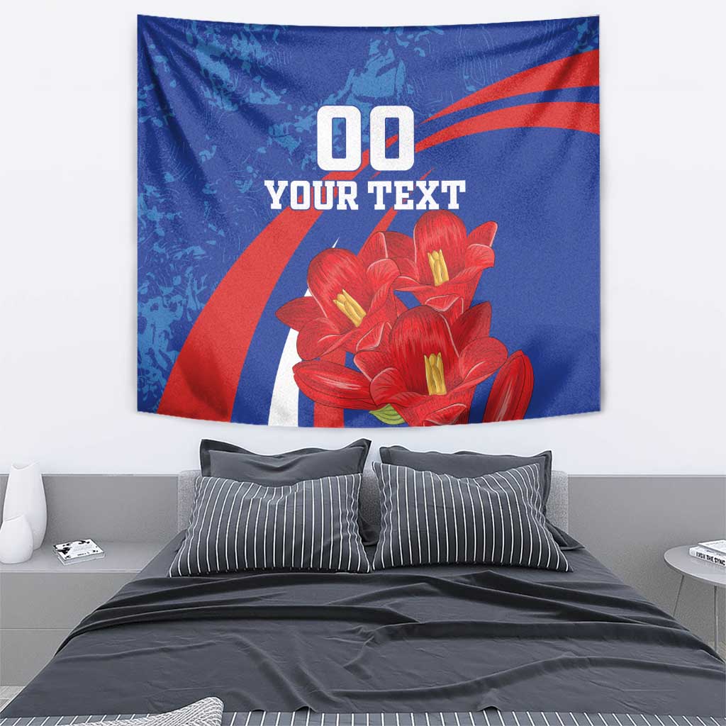 Blue tapestry featuring red lilies, diagonal stripes, and bold custom text display