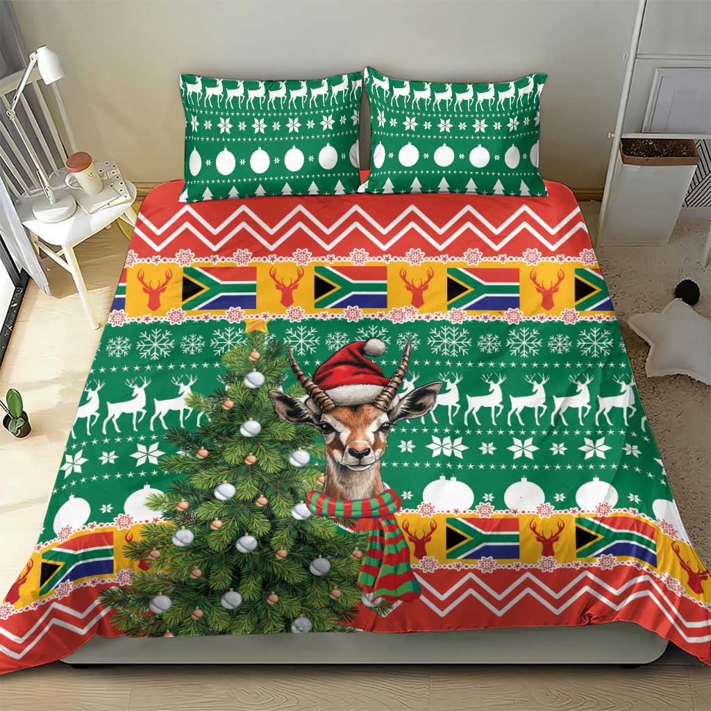 Christmas bedding set with green duvet, red chevron border, and deer and Springbok print