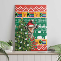 Christmas canvas wall art featuring springbok in Santa hat, striped scarf, and festive reindeer