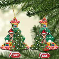 Ceramic Christmas tree-shaped ornament with springbok in red hat on green festive design