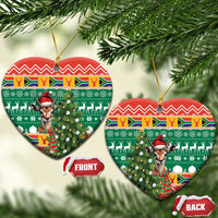 Heart-shaped ceramic Christmas ornament with springbok in red hat on green festive pattern