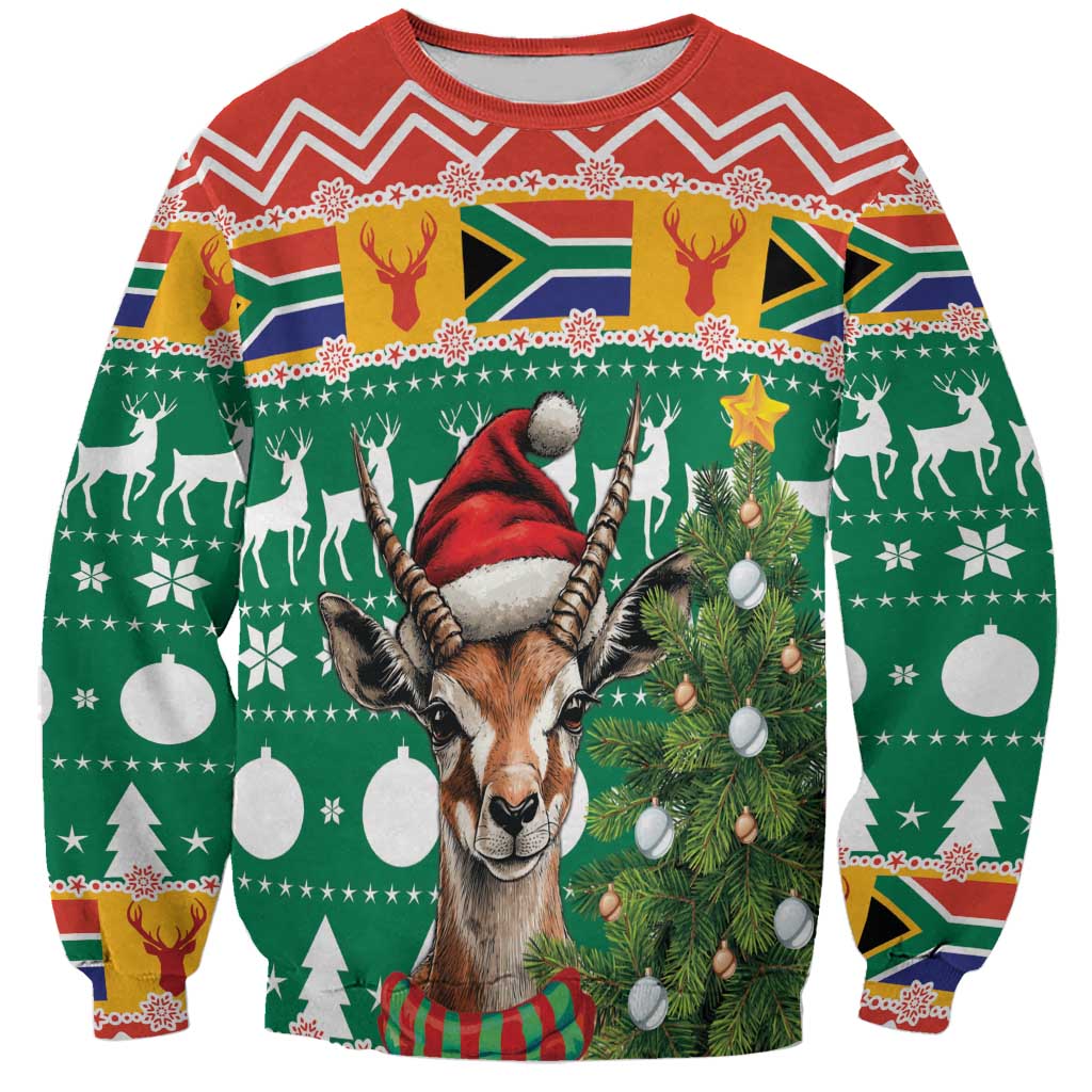 Green holiday sweatshirt with springbok wearing Santa hat and Christmas trees, ornaments