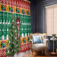 Green holiday curtain panel with springbok, antlers, candles and zigzag red trim