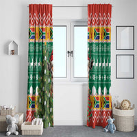 Pair of Christmas window curtains with green fabric, red chevrons, springbok and tree ornaments