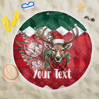Round Christmas beach blanket with fringe, green border, red plaid reindeer and flowers
