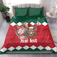 Christmas bedding set on bed: green top, red lower panel with deer and flowers, “Your Text”