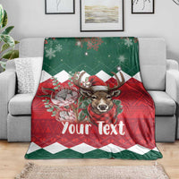 Personalized Christmas throw blanket on sofa, green/red deer with 'Your Text'