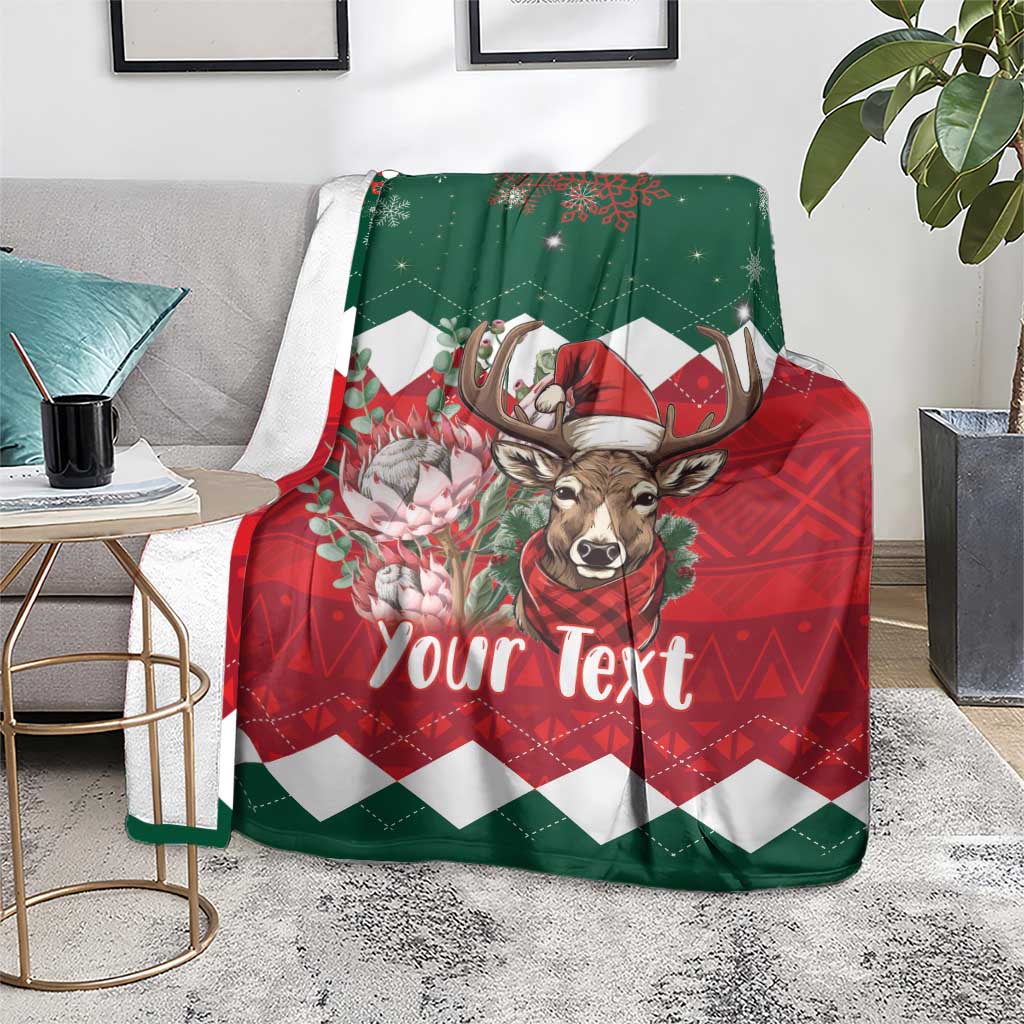 Personalized Christmas blanket on floor, green/red deer with 'Your Text' front