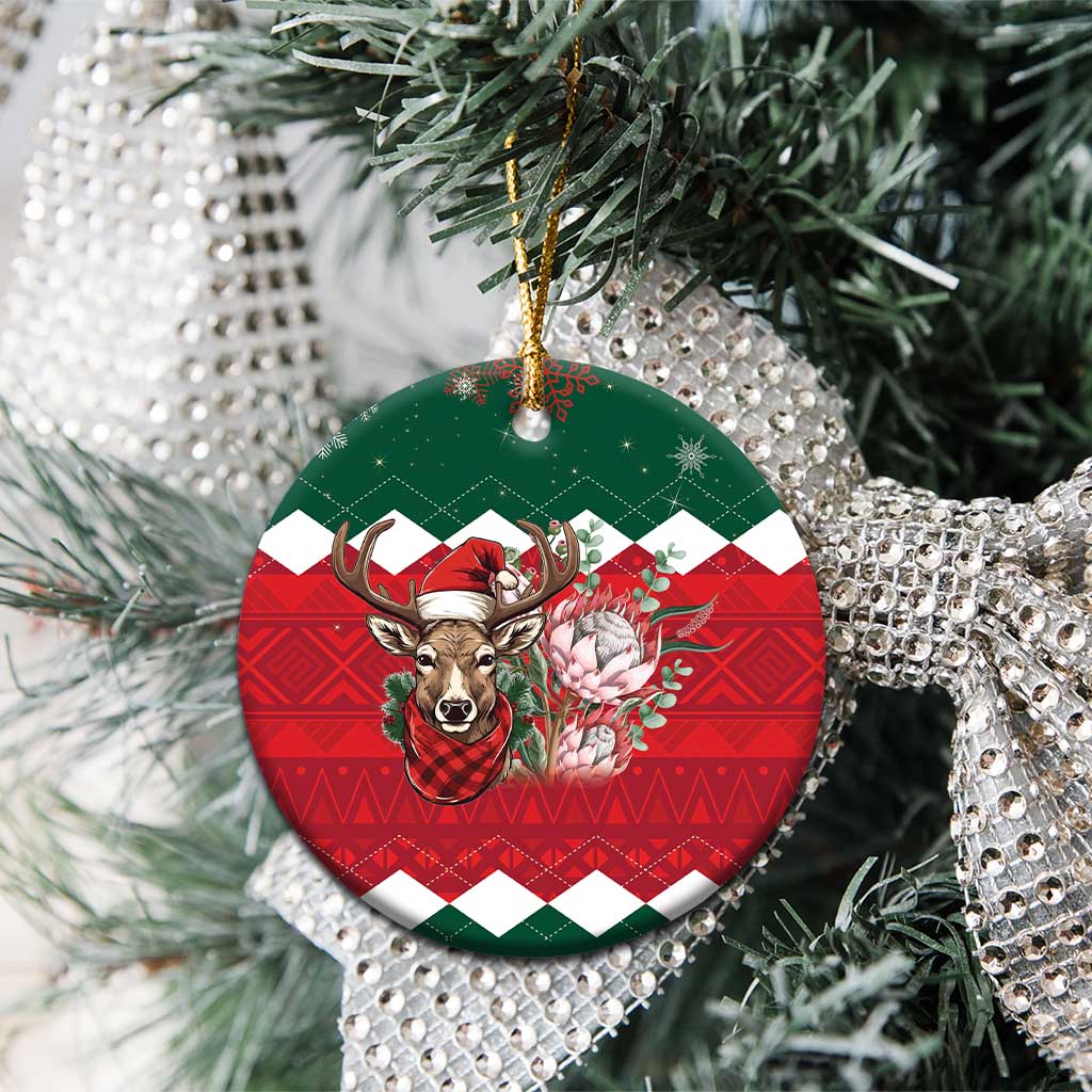 Ceramic round Christmas ornament hanging on silver tinsel, green top and red plaid reindeer floral