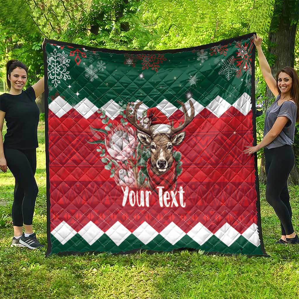 Personalized Christmas quilt on display, red-green with reindeer and 'Your Text'