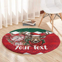 Round Christmas rug with deer and protea-like flowers, showing 'Your Text' center.