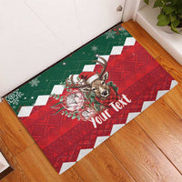 Personalized Christmas rubber doormat, diagonal view, red green with reindeer and Your Text