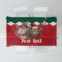 Personalized Christmas tablecloth with springbok and green/red floral design