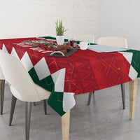 Christmas tablecloth with red and green geometric pattern and white border