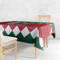 Red, green and white diamond Christmas tablecloth on table