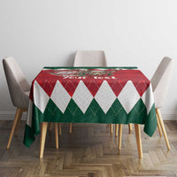 Geometric Christmas tablecloth in red, green and white on dining table