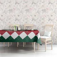 Red, green and white diamond Christmas tablecloth on dining table