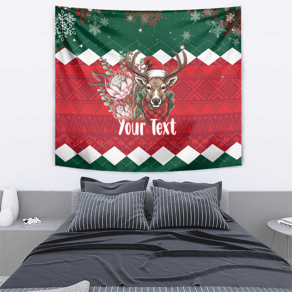Personalized Christmas wall tapestry in green and red with springbok and “Your Text”.