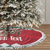 Round tree skirt with white fringe, red plaid and deer graphic on green background